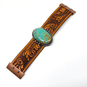 Flat view of Leather cuff bracelet with Pilot Mountain turquoise stone on brown western leather belt