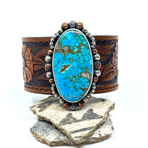 Leather cuff bracelet with Kingman turquoise stone on floral western leather belt