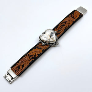 Flat view of Leather cuff bracelet with White Buffalo heart-shaped stone on floral western leather belt
