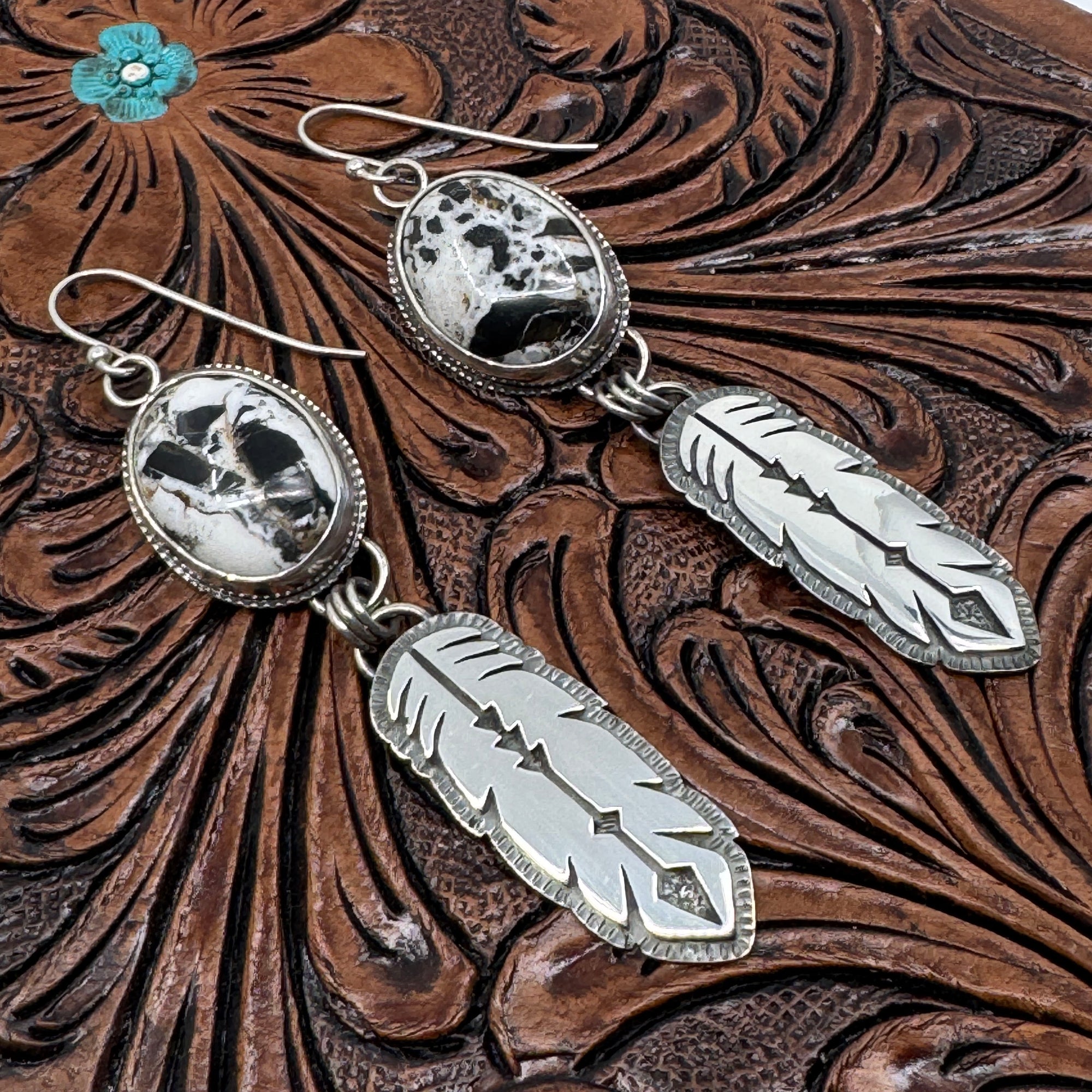 Handcrafted White Buffalo Feather Earrings in sterling silver. Western elegance meets free-spirited style—authentic jewelry made in Arizona.