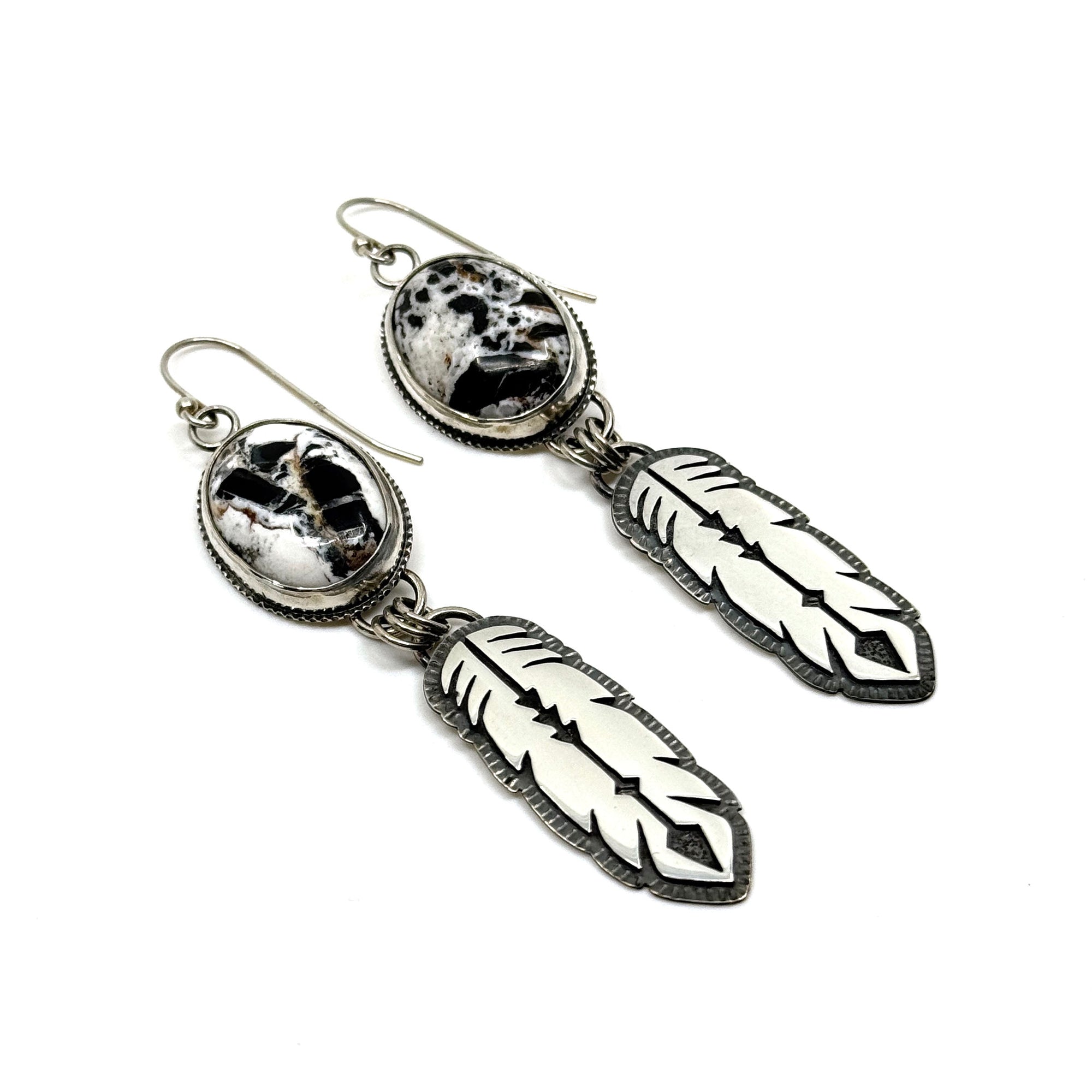 Handcrafted White Buffalo Feather Earrings in sterling silver. Western elegance meets free-spirited style—authentic jewelry made in Arizona.