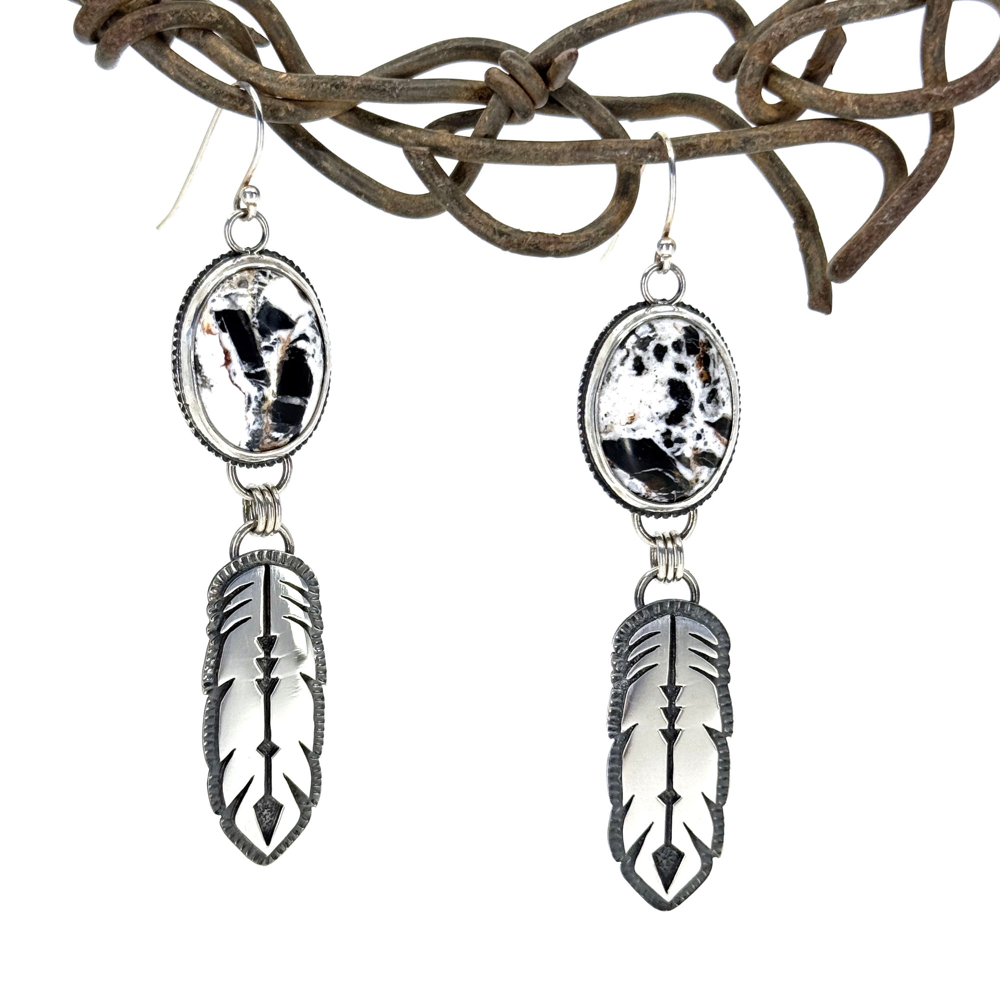 Handcrafted White Buffalo Feather Earrings in sterling silver. Western elegance meets free-spirited style—authentic jewelry made in Arizona.