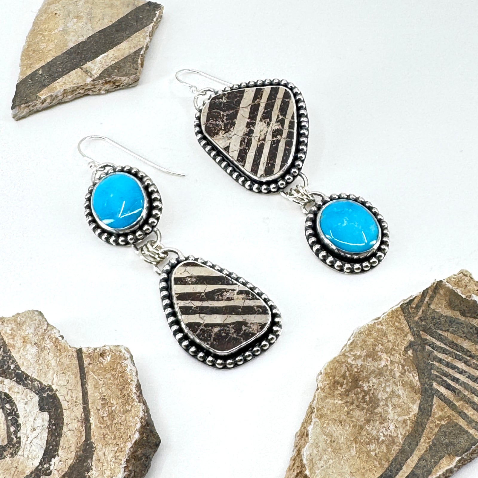 Asymmetrical earrings with Kingman turquoise and authentic pottery shards, handcrafted jewelry.