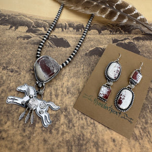 Sprit of the West Collection featuring Red Buffalo Turquoise jewelry with necklace and earrings, on a nature-themed background.