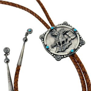 Silver bolo tie with a horse and rider design on a white background