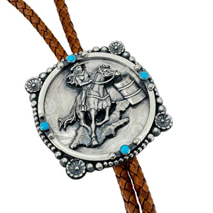 detail of Silver bolo tie with a barrel racer design on a white background
