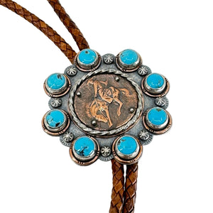Bolo tie with turquoise stones and a horse design on a white background