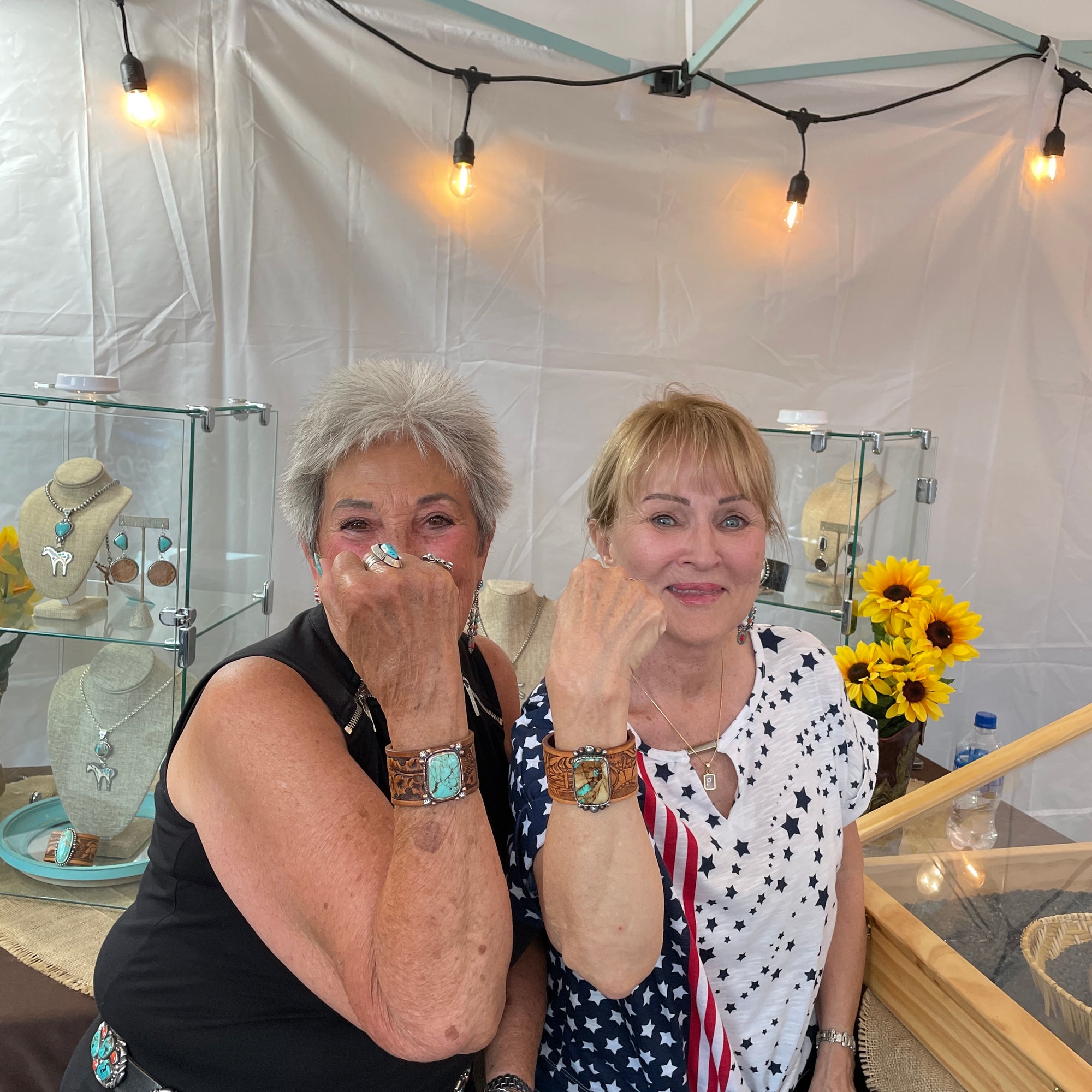 Two Prescott Rodeo fans posing wearing new Thunderheart Jewelry 
