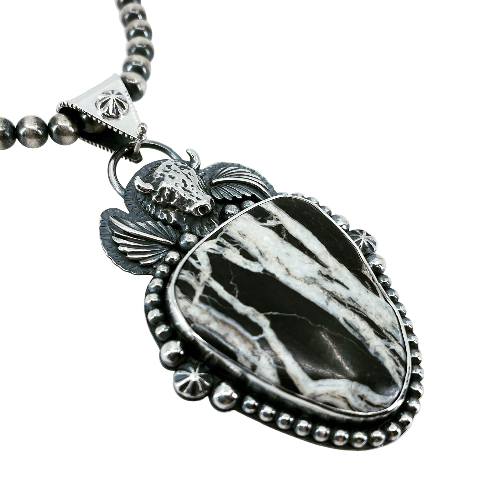 Detail of White Buffalo Lightning necklace with cast sterling silver buffalo and Navajo pearls, handcrafted Western jewelry