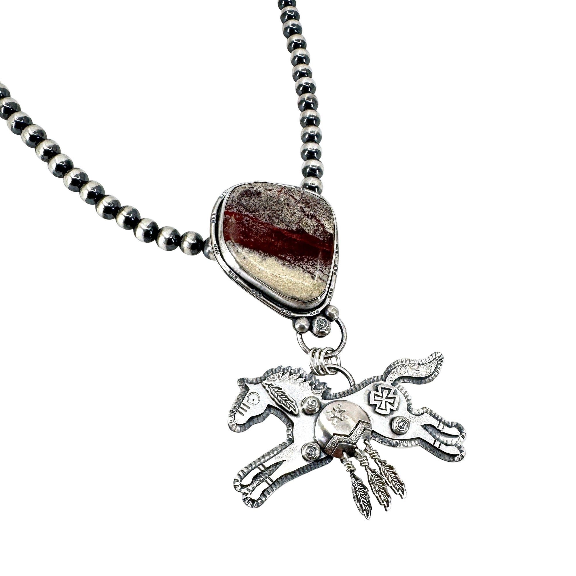 Sterling silver Spirit Horse necklace with rare red buffalo stone on Navajo pearls, handcrafted in Arizona by Thunderheart Jewelry.