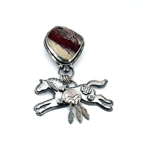 Sterling silver Spirit Horse pendant with rare red buffalo stone, handcrafted in Arizona by Thunderheart Jewelry.